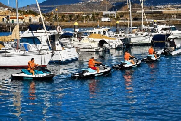 Jet skis leaving the harbour on a guided safari in Tenerife