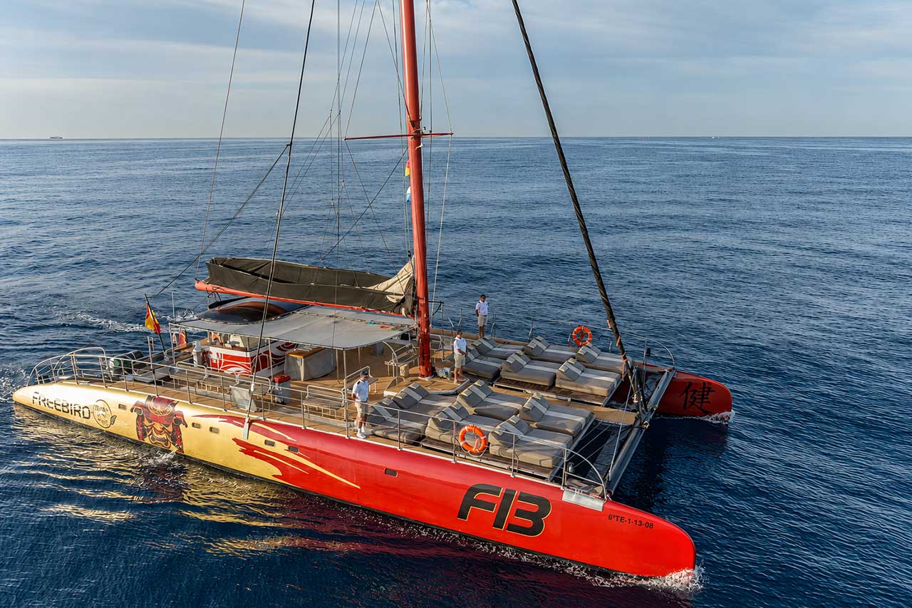 Aerial view of the Freebird F13 private catamaran featuring spacious sunbeds and an open deck for charter trips in Tenerife