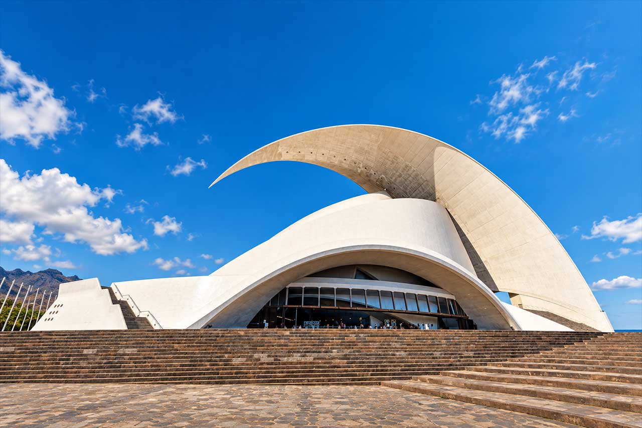 The striking Auditorio de Tenerife, representing the modern architecture visitors see while exploring Santa Cruz, the first stop of the tour.