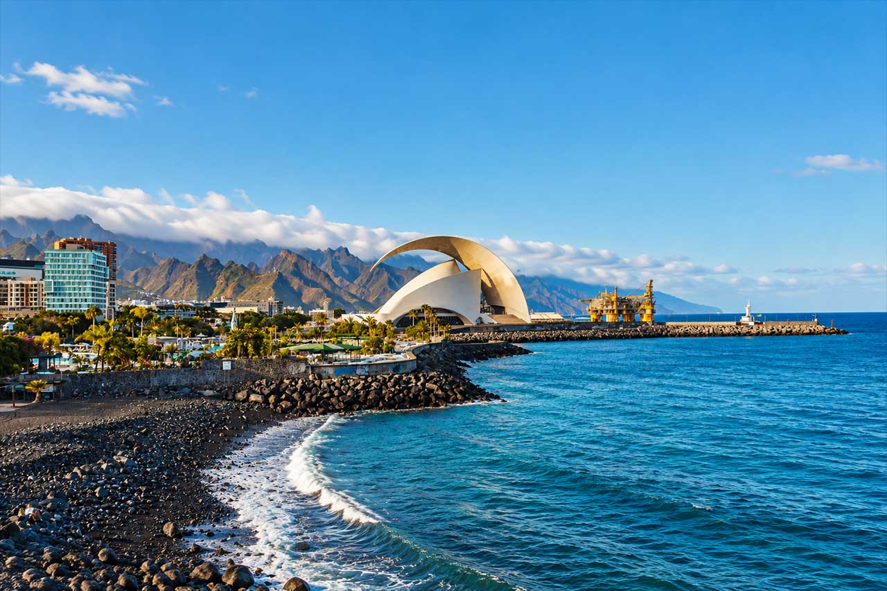 Panoramic view of Santa Cruz de Tenerife and the Auditorio beside the Atlantic, introducing the first main stop of the guided North Tenerife coach tour from the south.