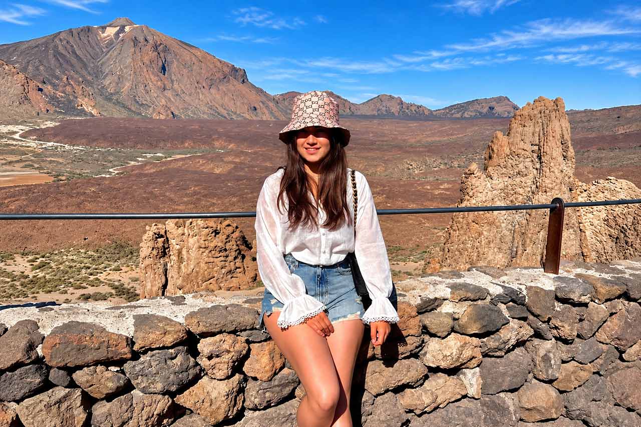 Visitor enjoying the vast volcanic scenery of Teide National Park, the first major stop on the Teide and Masca full-day sightseeing tour across Tenerife.