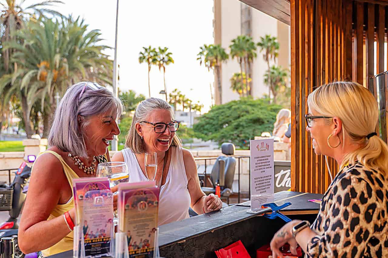 Guests checking in their Club Canary booking at the MHT venue desk