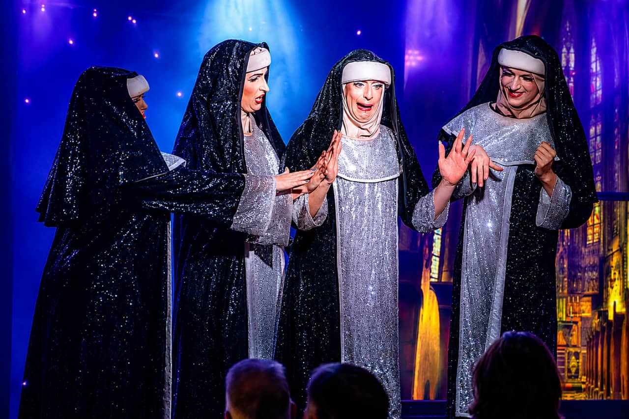 Four performers in sparkling nun costumes in a comedy scene at MHT