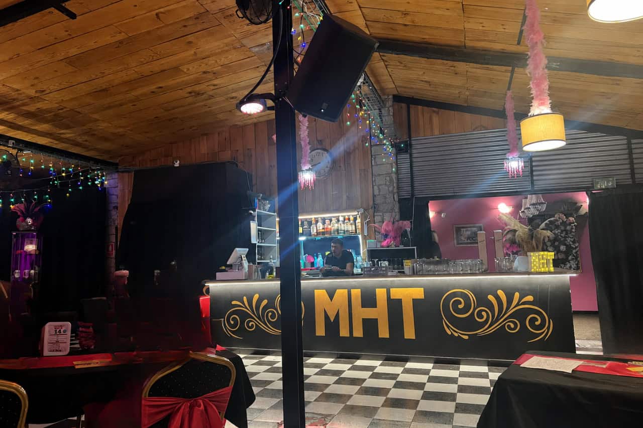 The bar inside Music Hall Tavern Tenerife with MHT branding