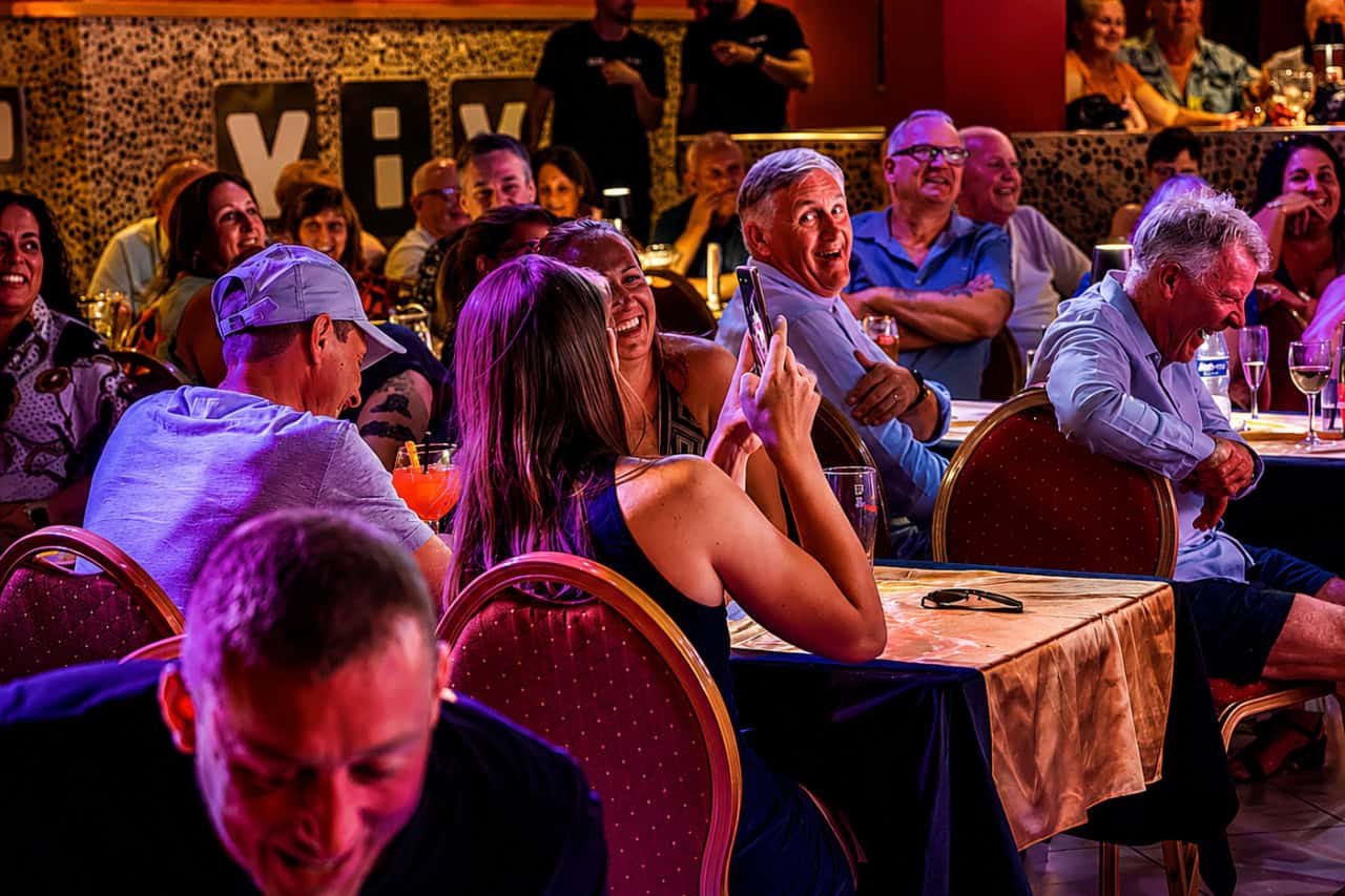 A guest taking a phone photo during the MHT drag show in Tenerife
