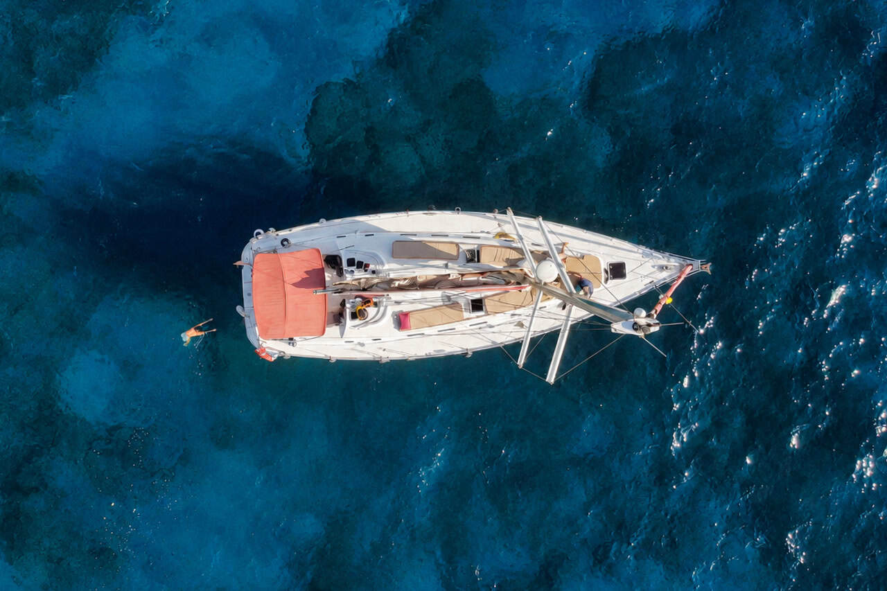 Aerial view of the Atlantic Star sailing boat cruising through the clear Atlantic Ocean during a whale-watching tour in Tenerife.