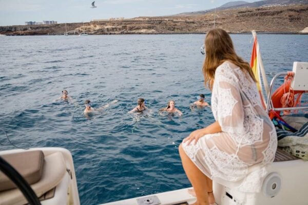 Group of people snorkeling in the sea during a whale watching boat tour with Atlantic Star Tenerife