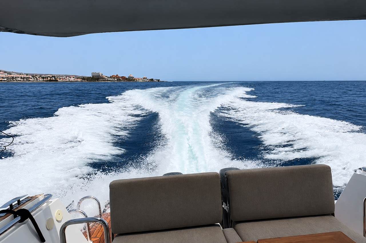 Rear seating of the White Heaven with the boat wake behind