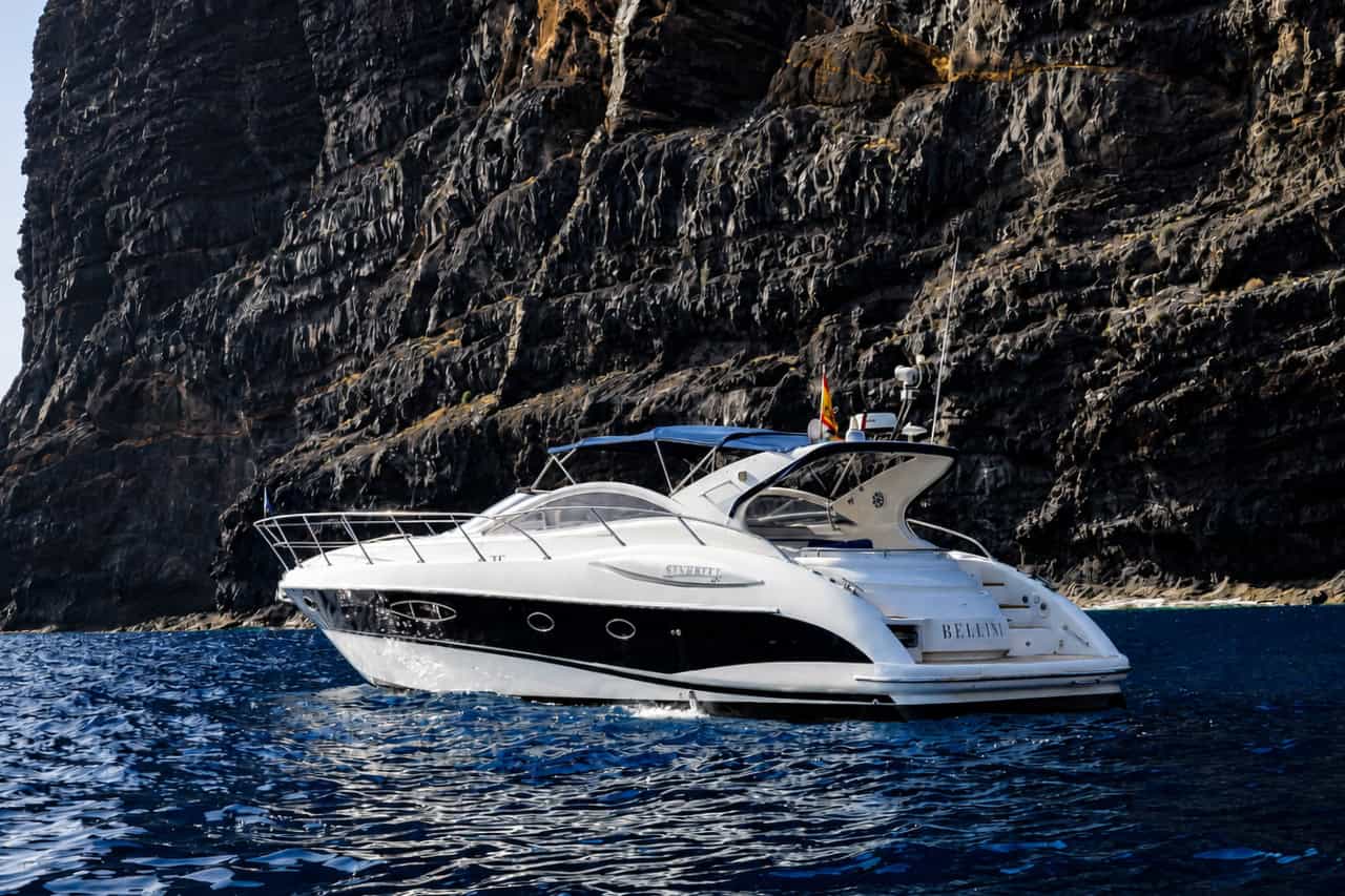 Bellini luxury yacht sailing beside the Los Gigantes cliffs in Tenerife on a private yacht charter from Los Gigantes.
