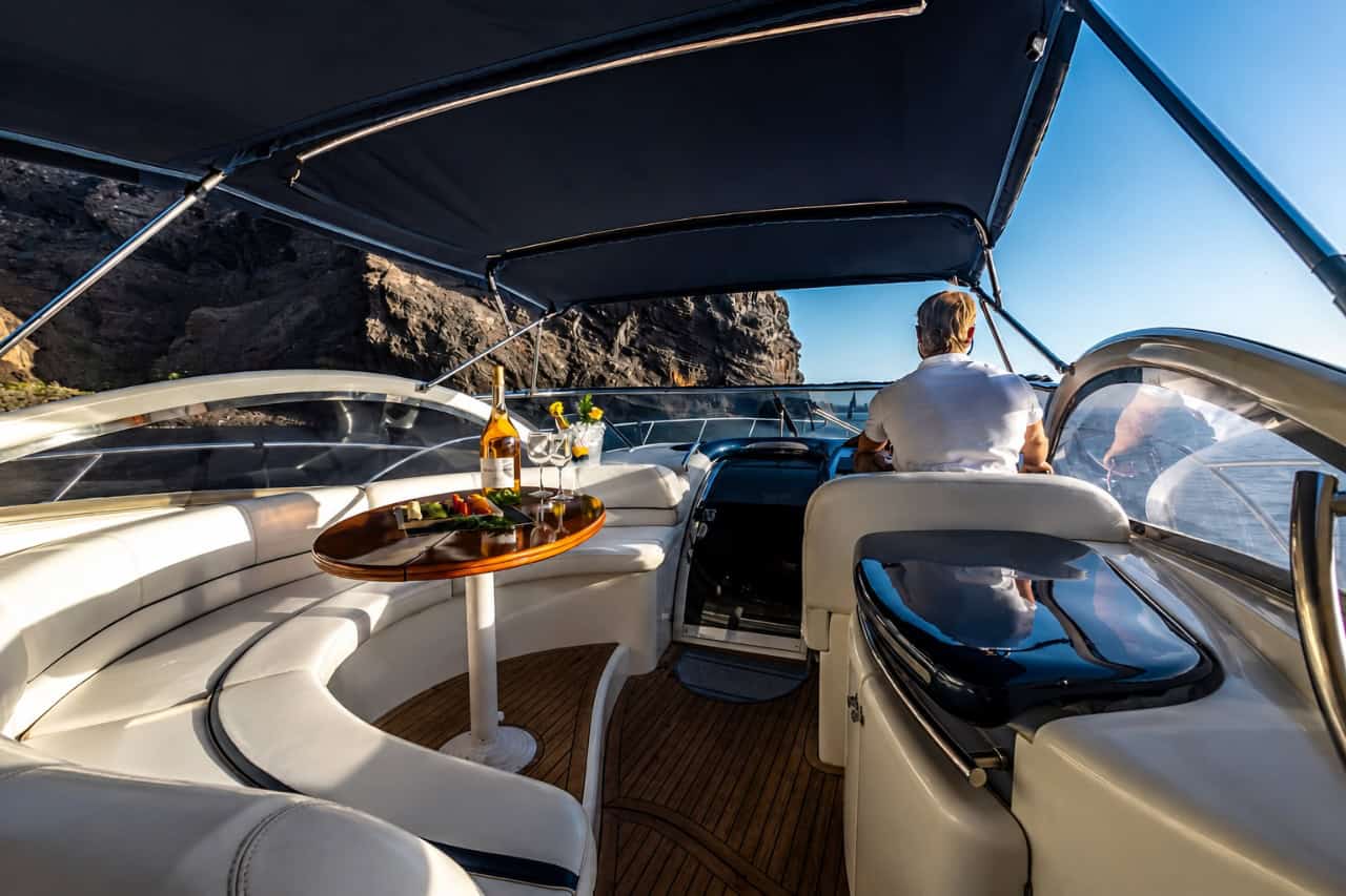 Lounge area and captain aboard the Bellini yacht