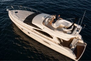 The Seaduction luxury motor yacht cruising in Tenerife’s Atlantic waters, featuring spacious outdoor seating, a flybridge and premium private charter facilities.