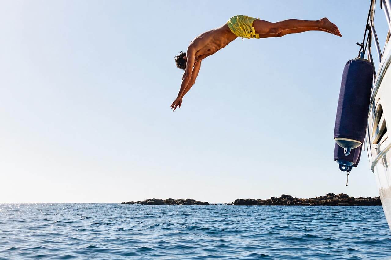 Guests swimming and diving from the Seaduction
