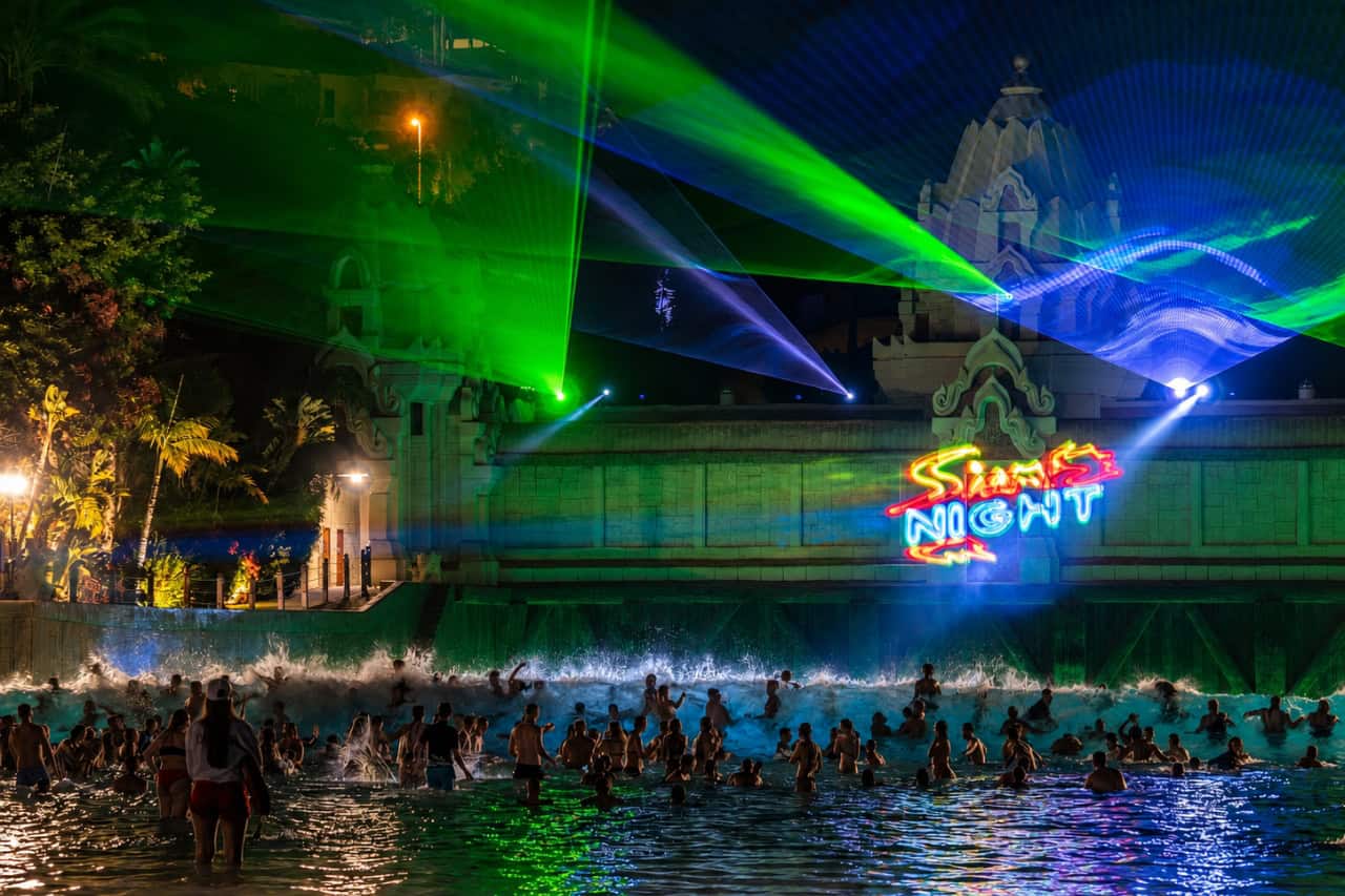 Wave pool with lasers during Siam Park Night in Tenerife