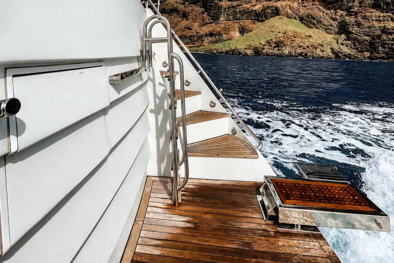 Teak deck and swimming platform on the Rockstar private yacht while cruising along the Los Gigantes coastline in Tenerife.