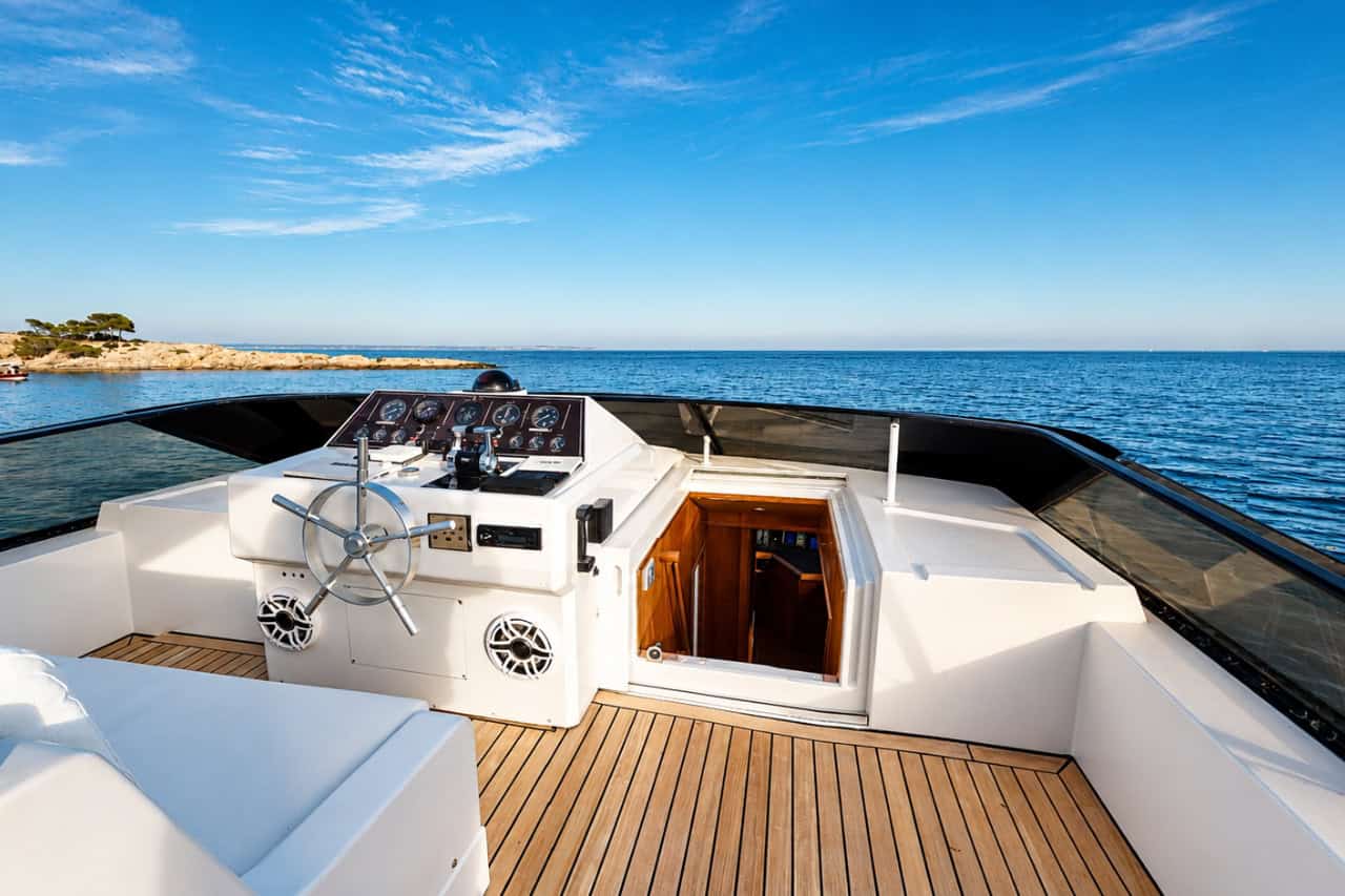Spacious flybridge and helm with Atlantic Ocean views during a private island hopping yacht trip in the Canary Islands.