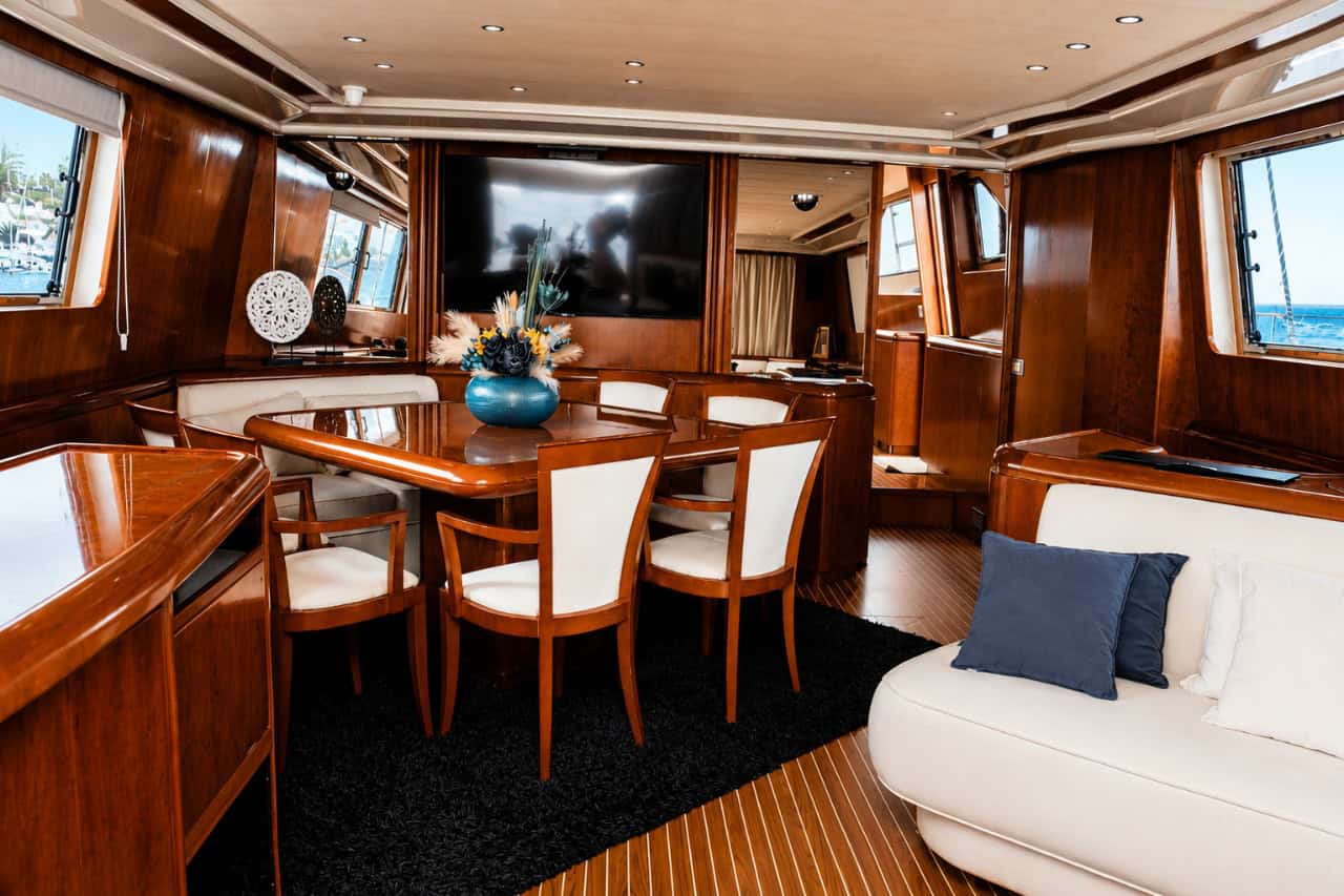 Elegant interior salon and dining area aboard the Rockstar yacht, designed for private luxury yacht charters and exclusive events in Tenerife.