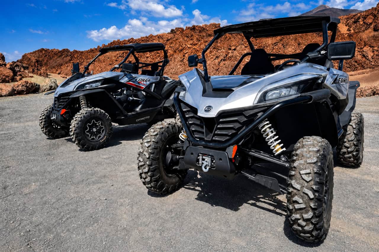 Two CFMOTO ZForce buggies parked among the volcanic rock formations of Tenerife.