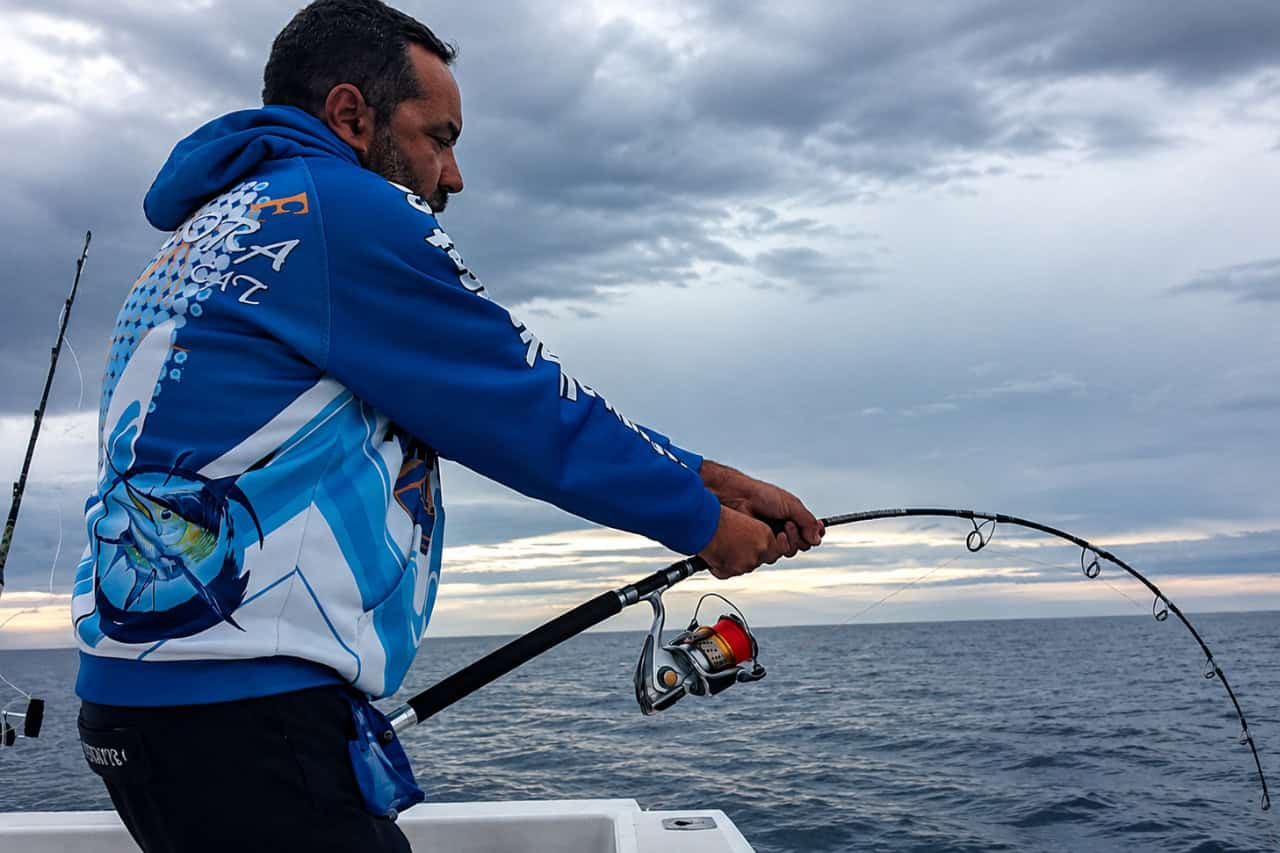 Fisherman reeling in a powerful catch off Fuerteventura