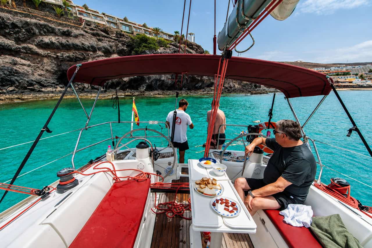 Guests enjoying tapas aboard the sailing yacht along the Fuerteventura coast