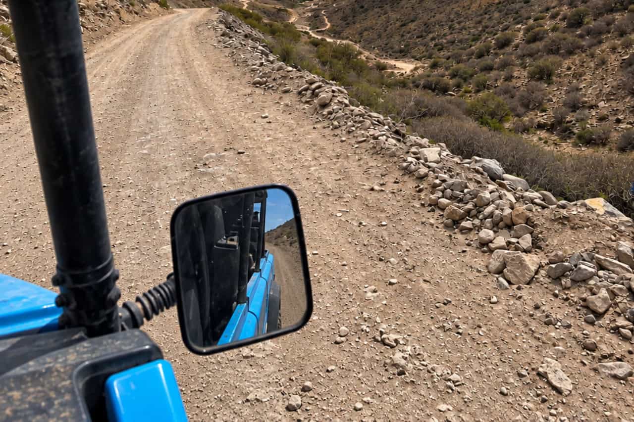 A buggy on a hill track with views over the coast of Gran Canaria