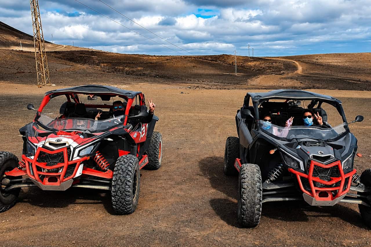 Riders posing with their buggies on the Lanzarote tour