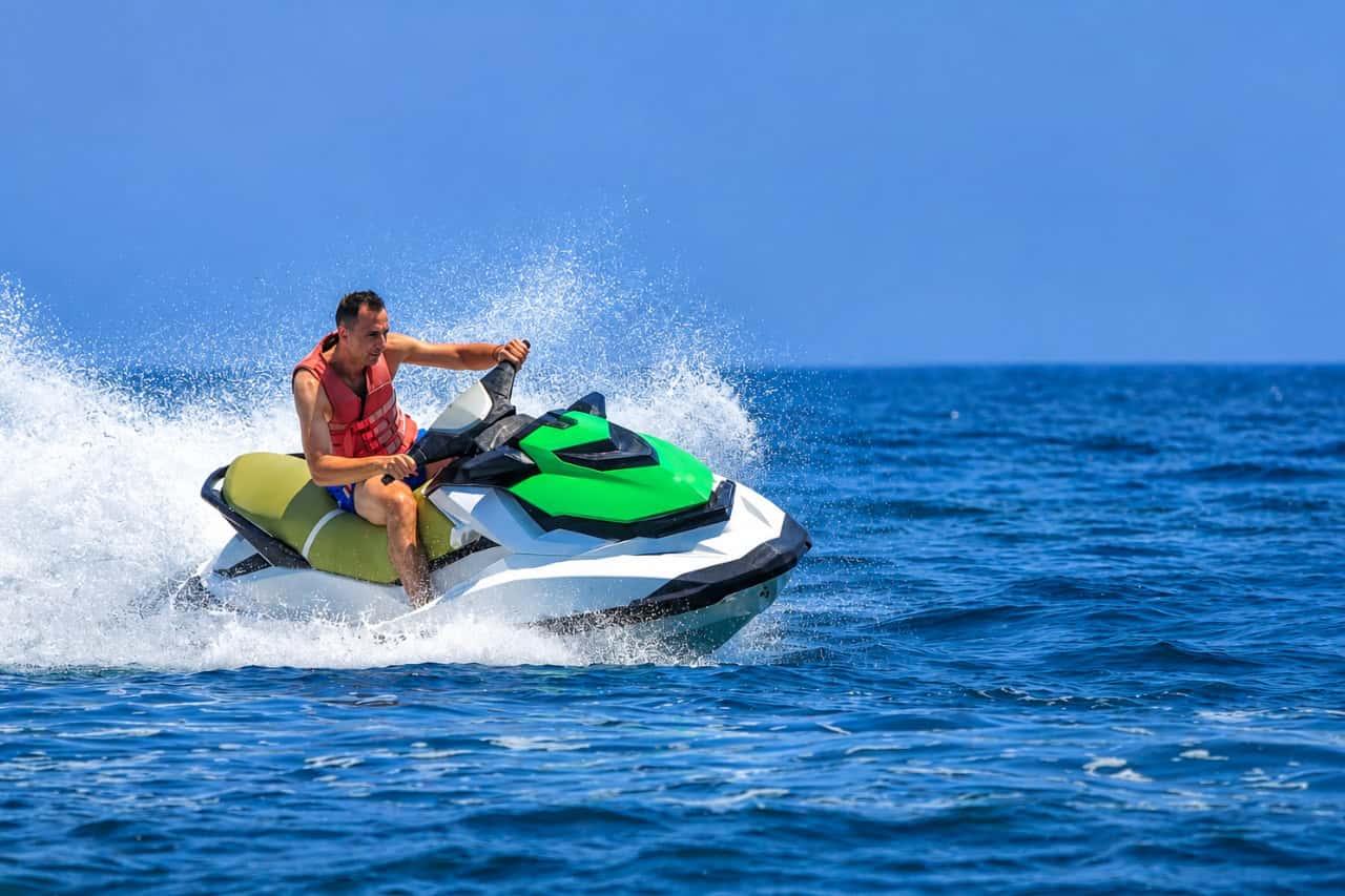 Man riding a jet ski at speed across the Atlantic near Fuerteventura