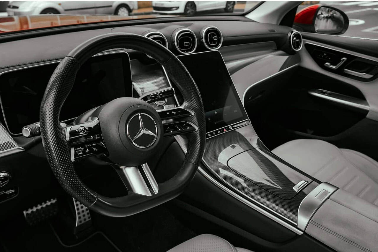 Driver view of the Mercedes GLC 300 de interior with steering wheel and digital display
