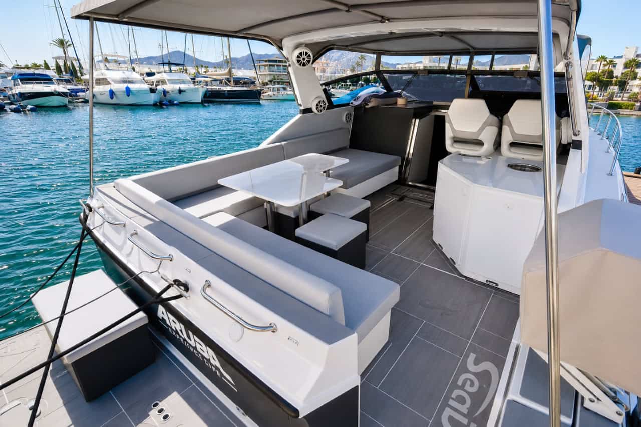 Modern outdoor seating and dining area on a luxury yacht in Playa Blanca marina
