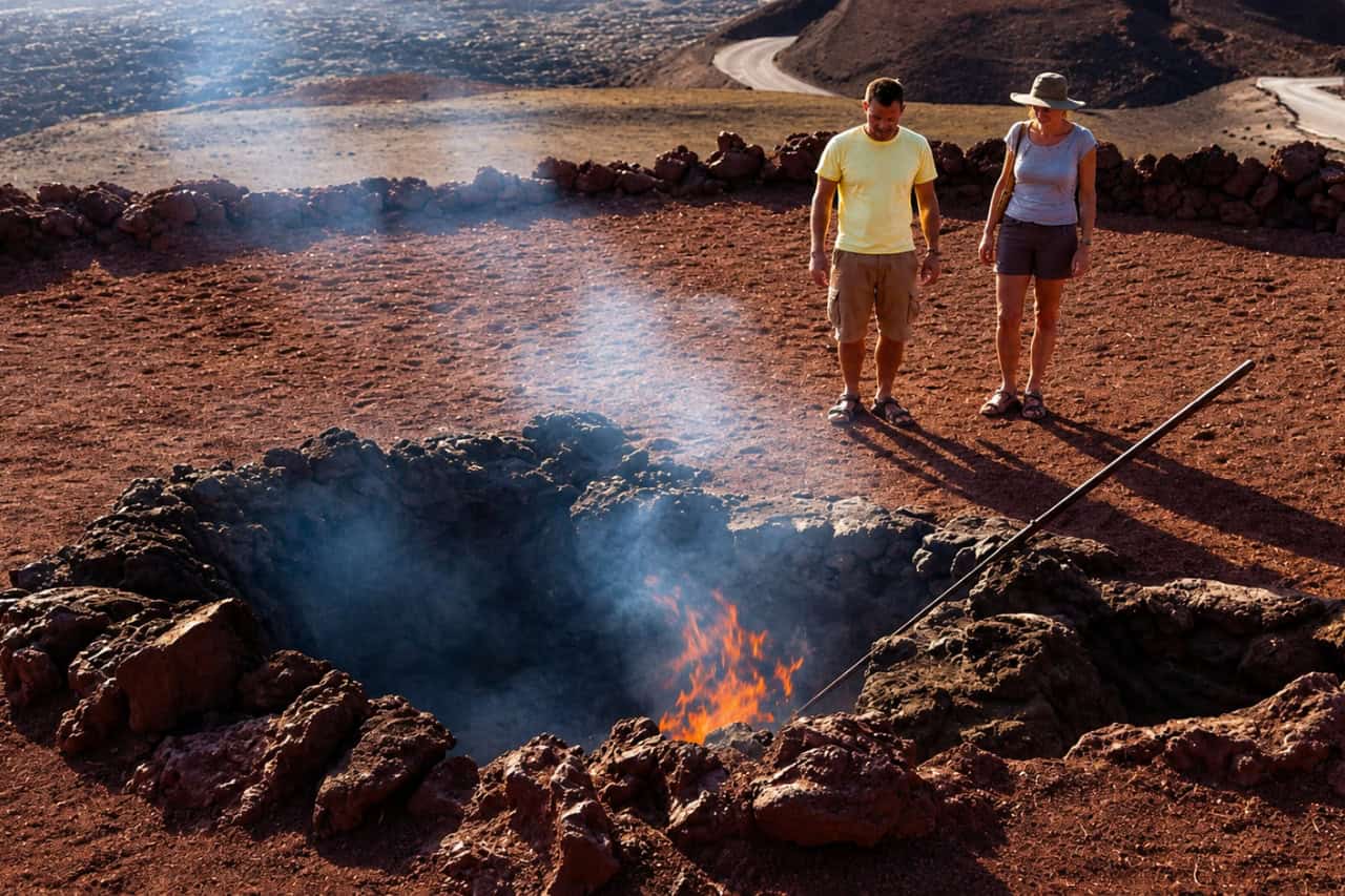 Fire demonstration in the hot ground of Timanfaya National Park