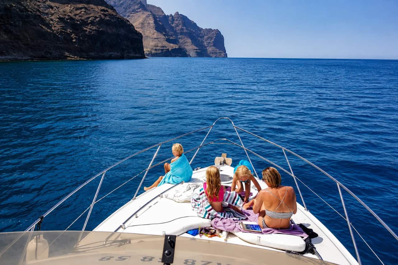 Guests relaxing on the bow while cruising along the Gran Canaria coast
