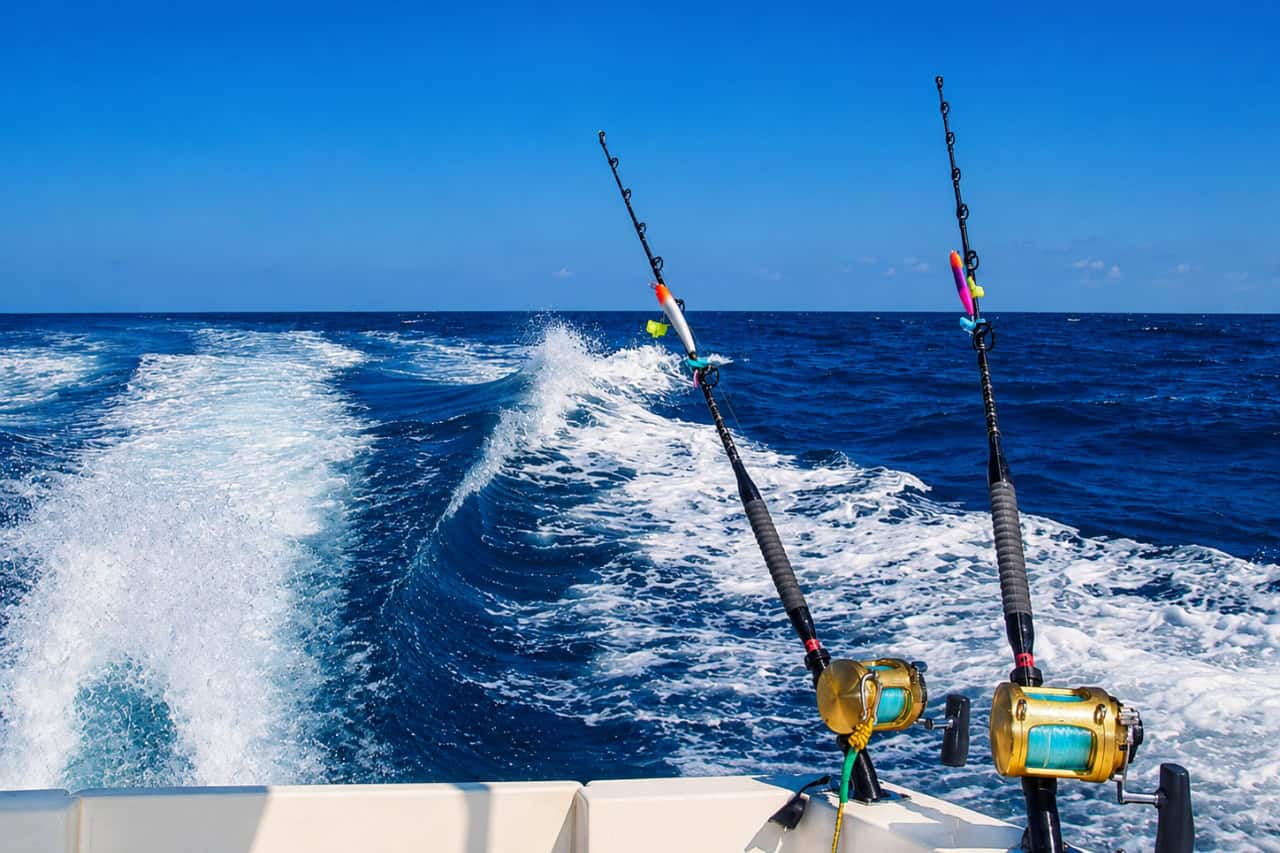 Two big-game fishing rods set for trolling behind a moving boat in the Atlantic Ocean near Lanzarote.