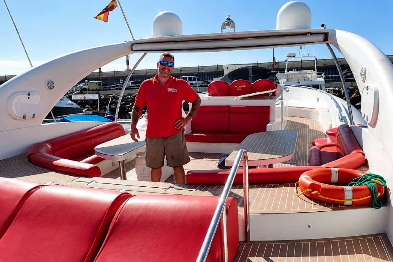 Spacious rear deck and red seating area on board the Opera 60 in Puerto Colon