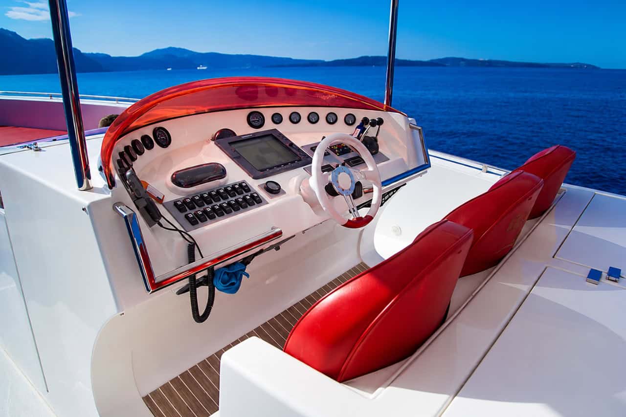 Steering console, navigation equipment and red captain seats on the Opera 60 private charter