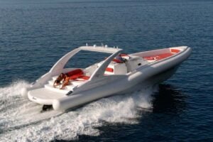 Opera 60 private charter cruising at speed across the ocean in Tenerife
