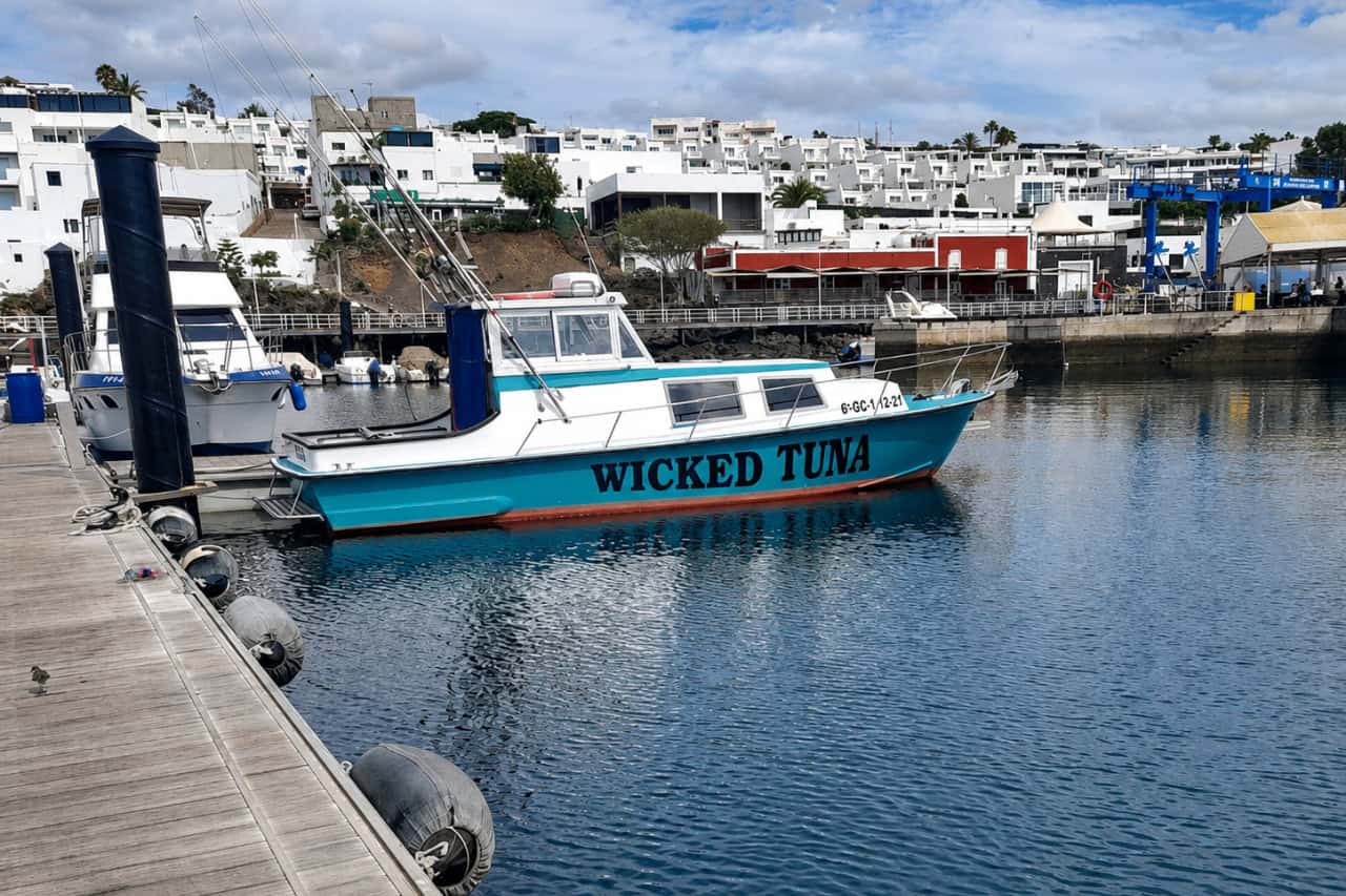Wicked Tuna fishing boat moored in a marina in Lanzarote, ready for a deep-sea fishing trip.