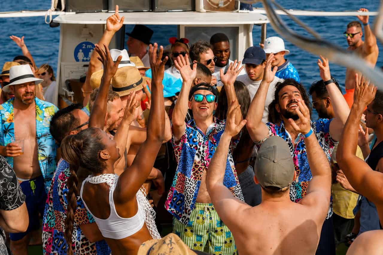 People dancing and celebrating on a Gran Canaria boat party