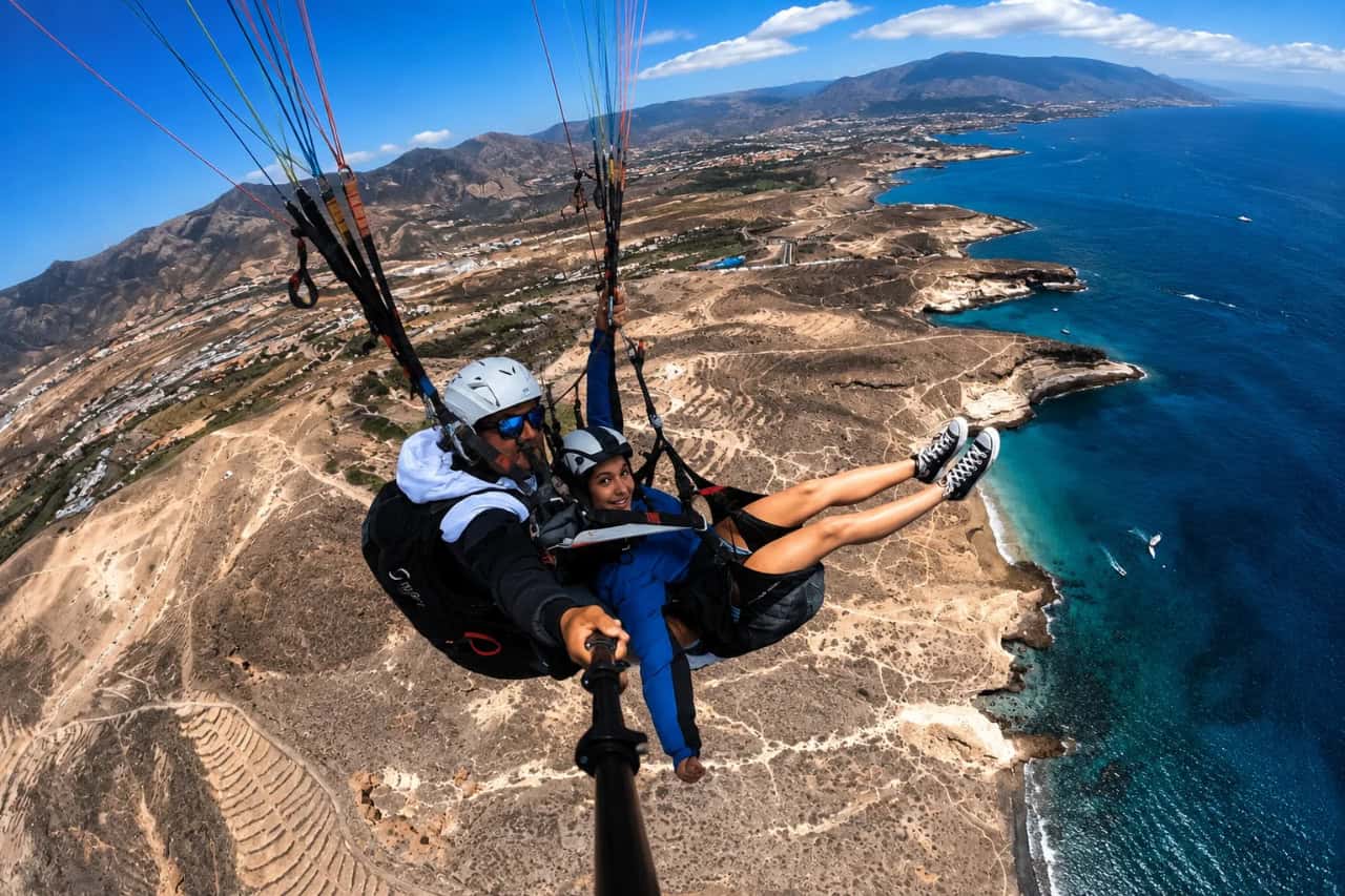 Tandem paragliding in Tenerife with panoramic views over the coastline and Atlantic Ocean