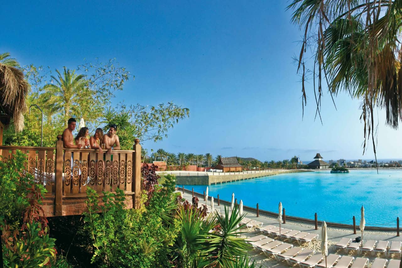 Guests enjoying a Siam Park cabana with views over the lagoon in Tenerife.