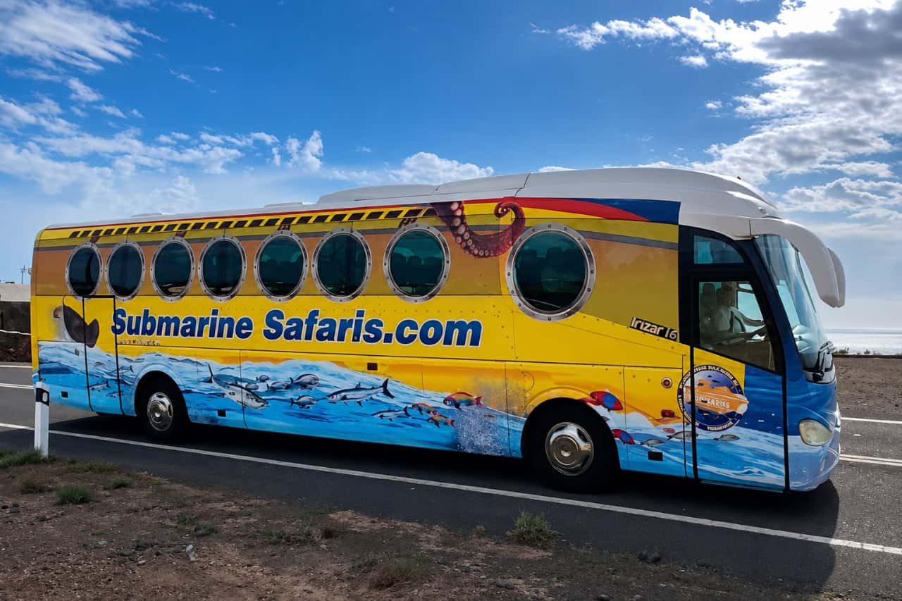 Yellow Submarine Safaris bus used to transport guests to the submarine tour departure point.