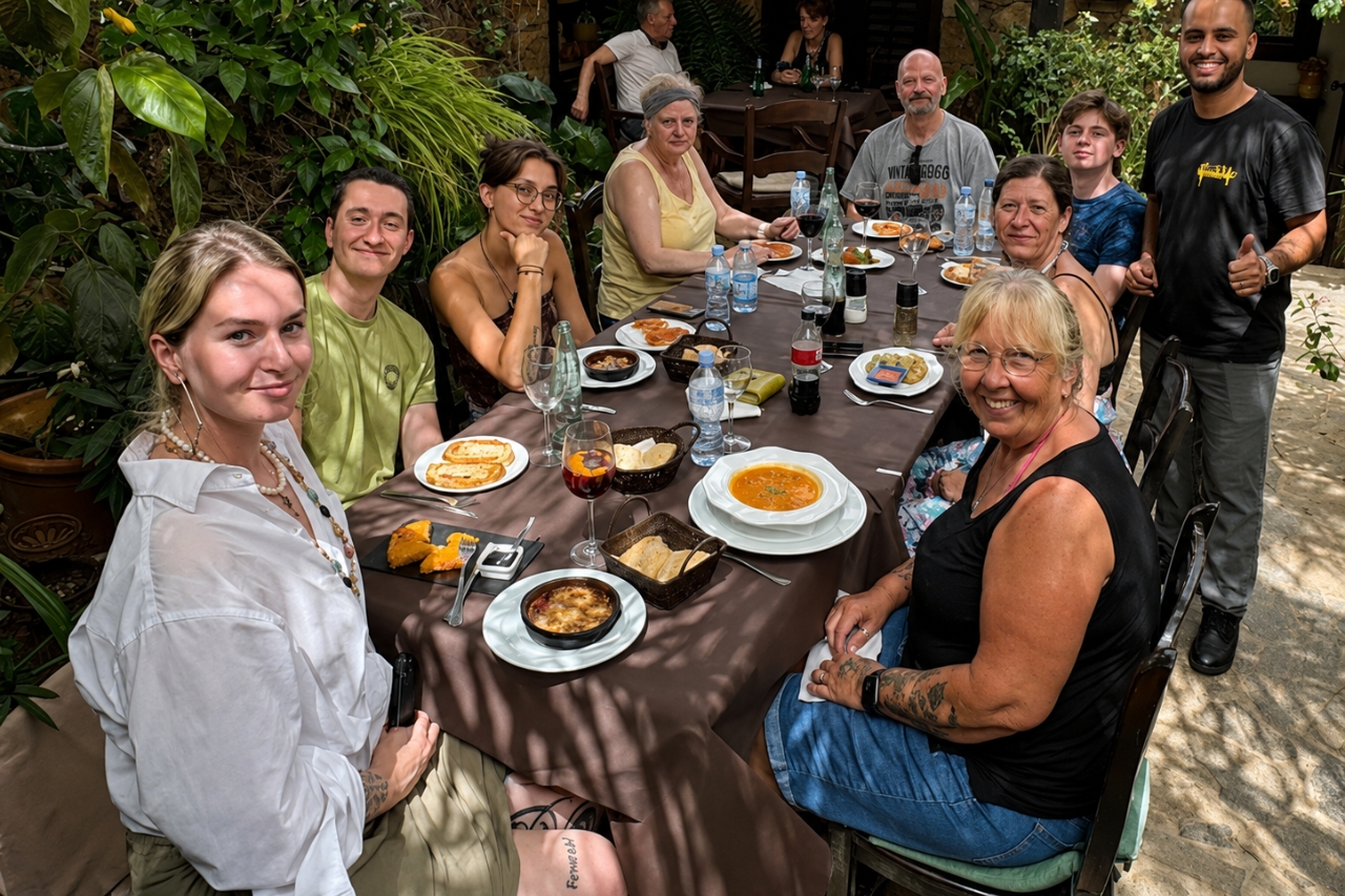 Guests enjoying a traditional Canarian lunch in a restaurant courtyard in Fuerteventura