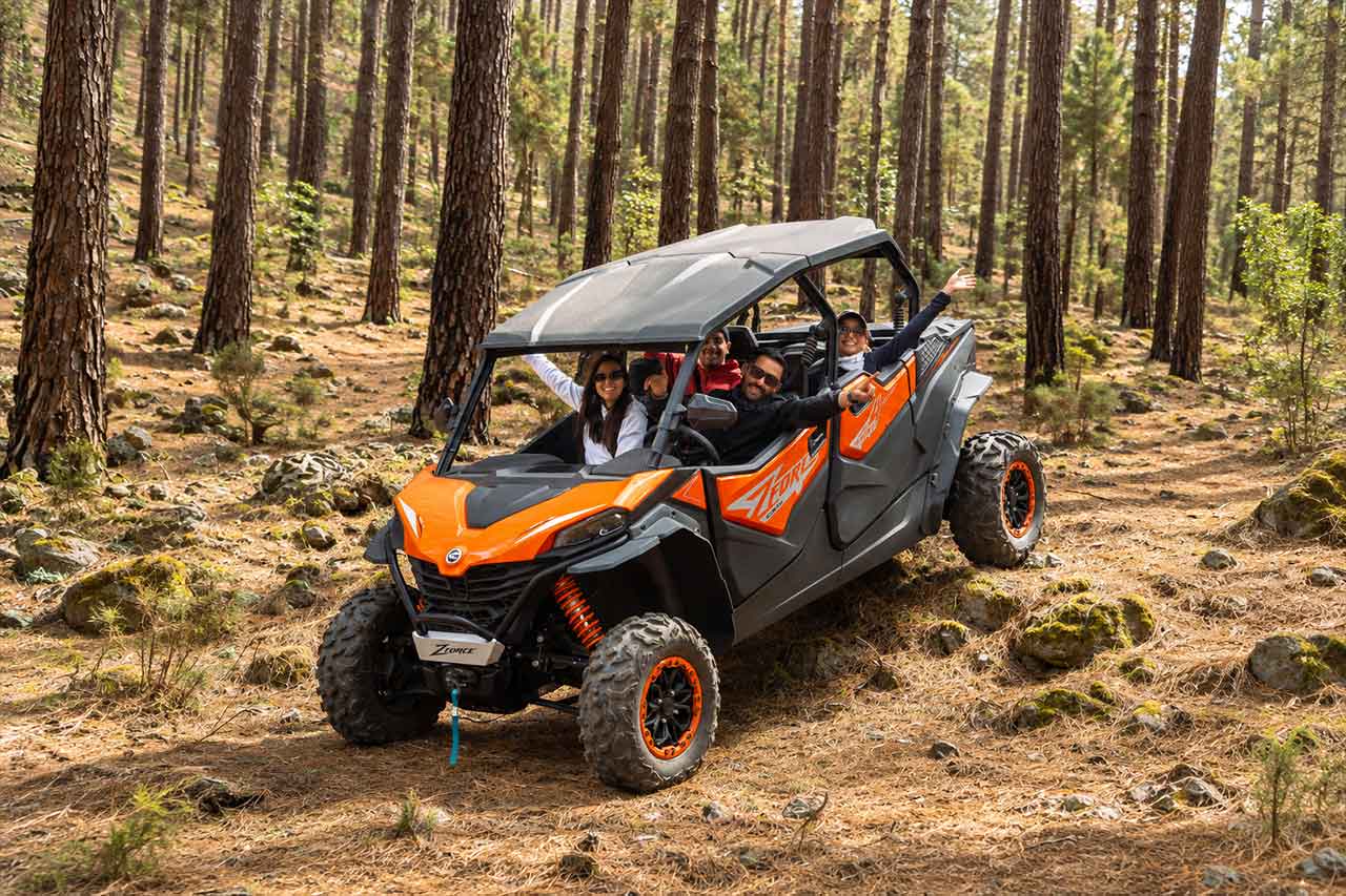 Four guests enjoy a 4-seat buggy surrounded by Tenerife’s pine forest scenery, highlighting the social side of the Puerto de la Cruz buggy tour and the larger buggy option available for groups and families.