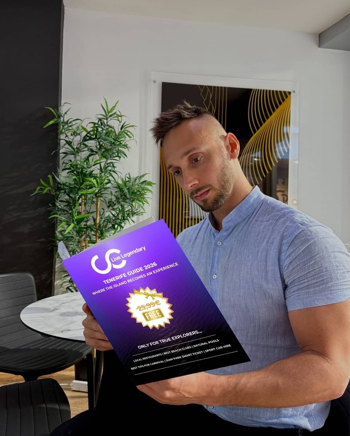 Roy Schijvens reading the Club Canary Tenerife Travel Guide 2026