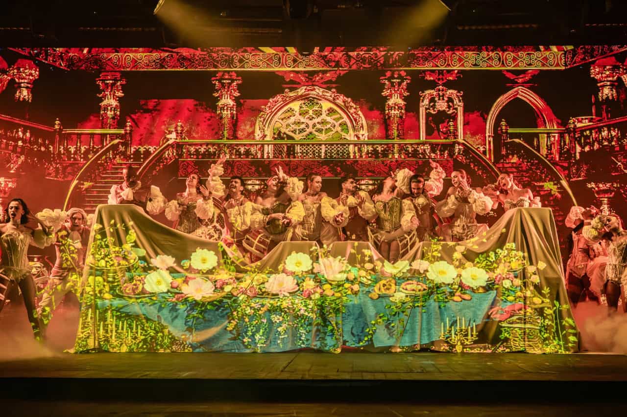 The cast performs during a dinner show in Gran Canaria at Sala Scala with theatrical lighting