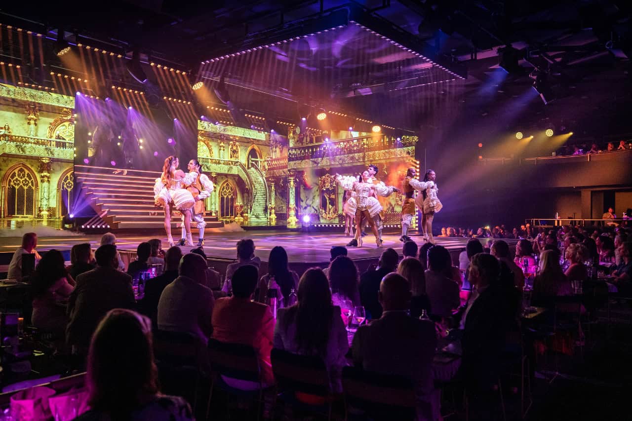 Dancers performing on stage while guests watch the Nomad dinner show in Gran Canaria