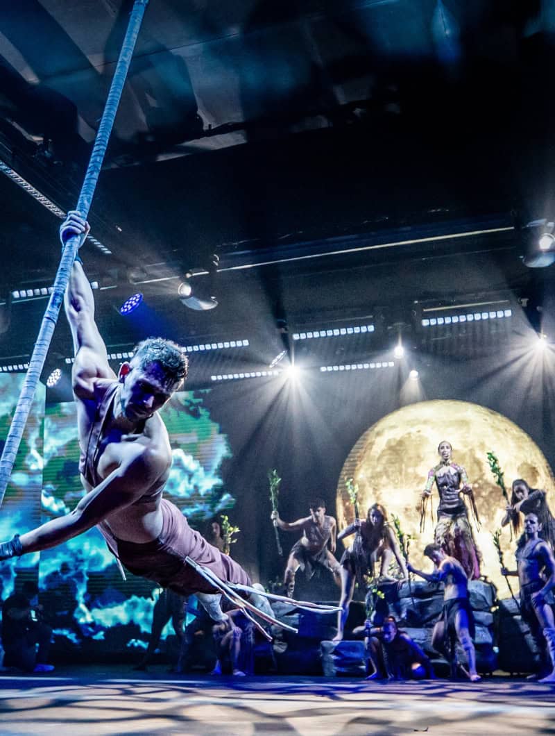 An aerial performer and dancers appear on stage during the Sala Scala evening show in Gran Canaria