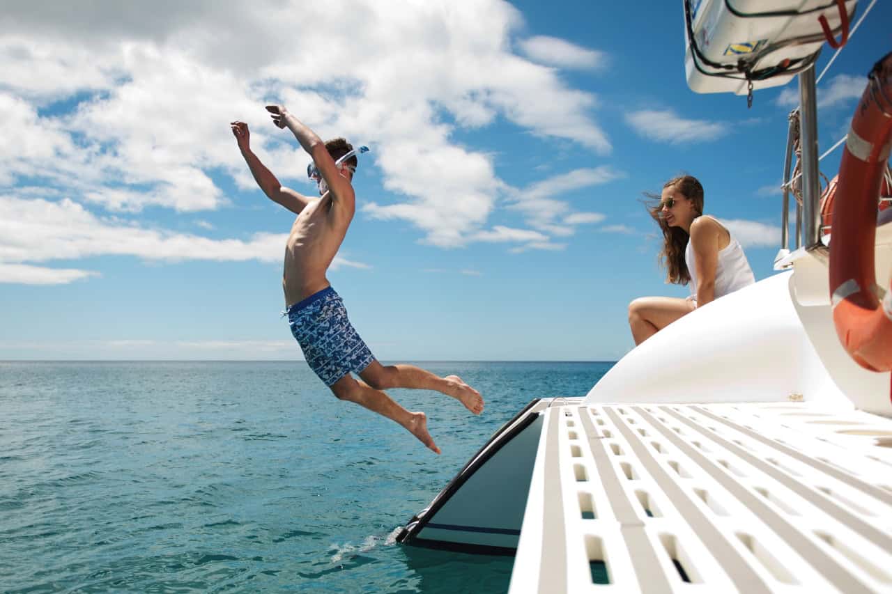 Guest jumping off the catamaran at the swim stop in Morro Jable