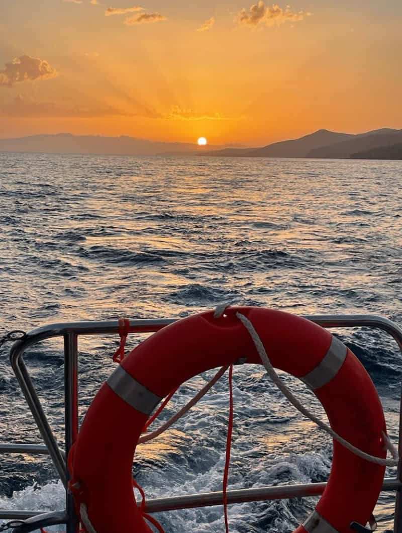 Golden sunset over the sea on a private catamaran trip from Gran Tarajal, Fuerteventura