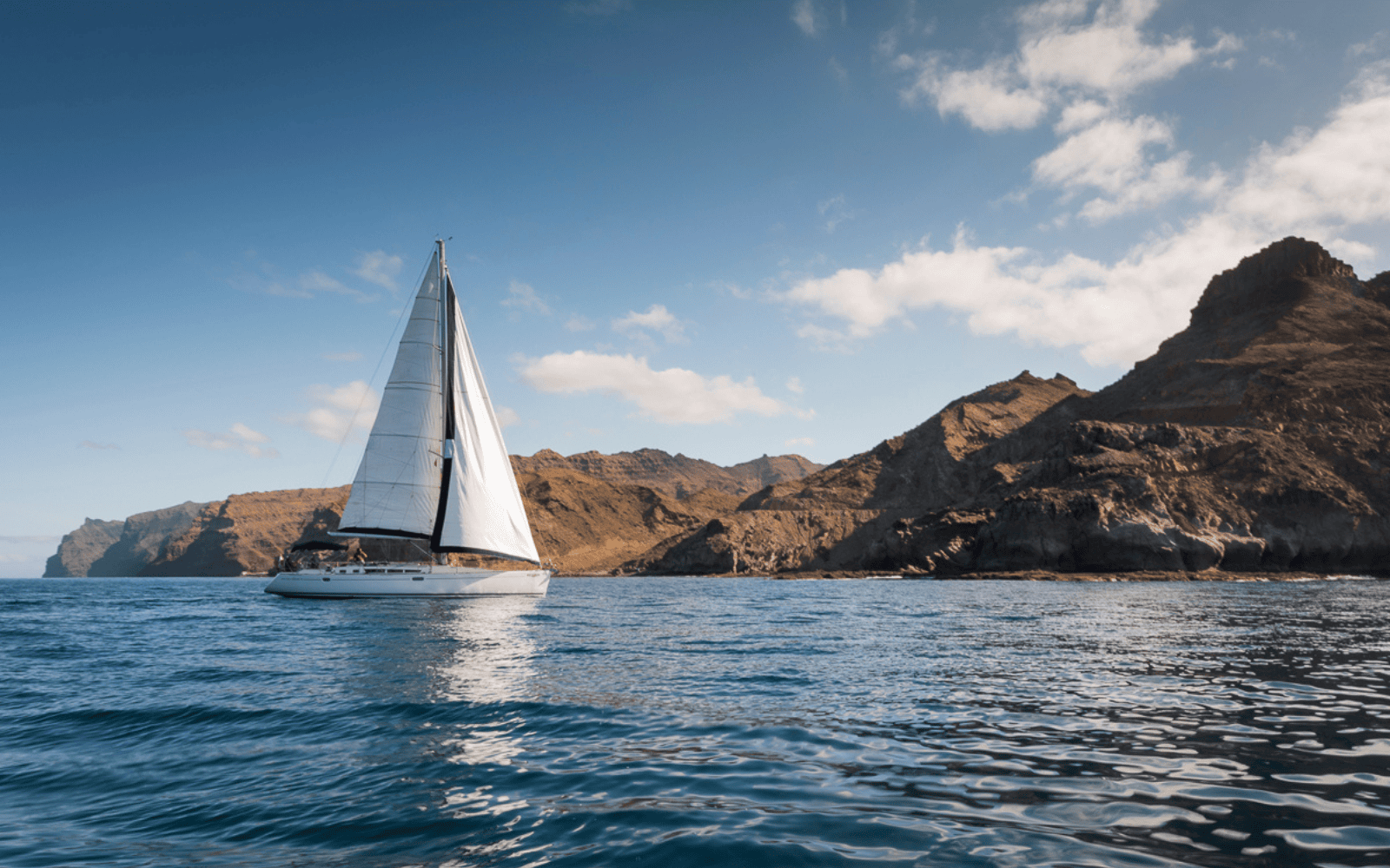 Snorkel stop and swim in a secluded bay on the Karolka sailing trip in Gran Canaria