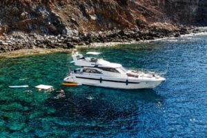 Blue M yacht anchored in clear water during a Gran Canaria boat trip