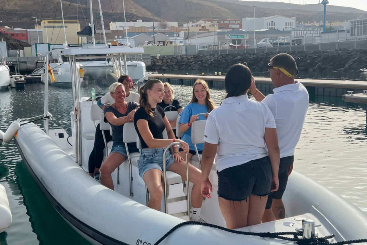 Guests boarding a small boat for dolphin watching from Morro Jable, Fuerteventura